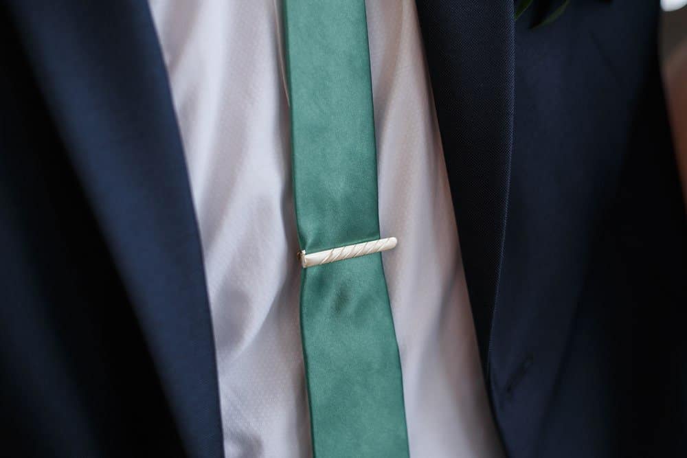 blue suit and green tie