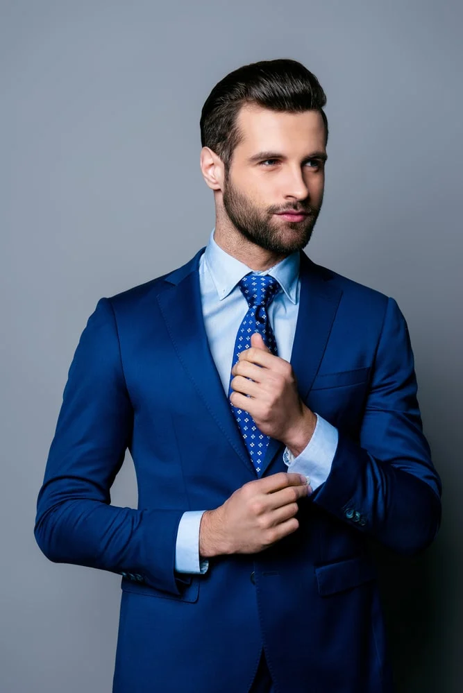 blue suit blue shirt and blue tie