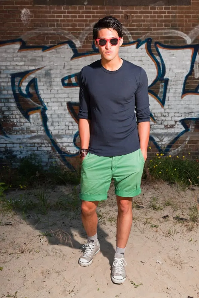 green shorts and black shirt