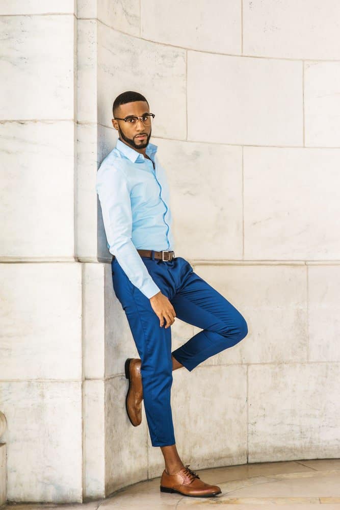 Free Photo | Portrait of serious man in blue shirt and black pants with  crossed arms - isolated on white