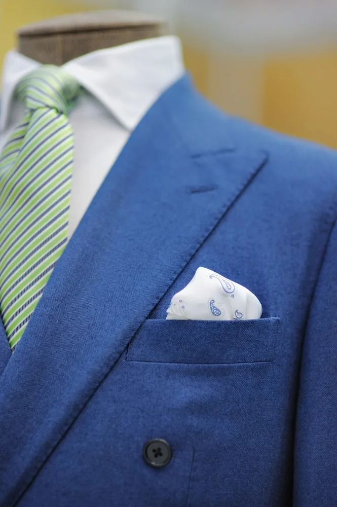  light blue suit with green tie