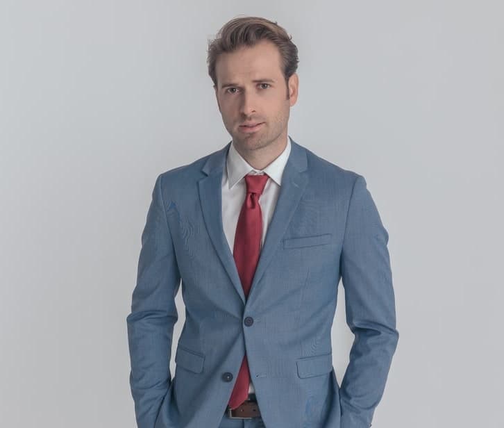 light blue suit with red tie 
