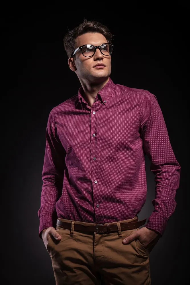 man in maroon shirt and tan pants