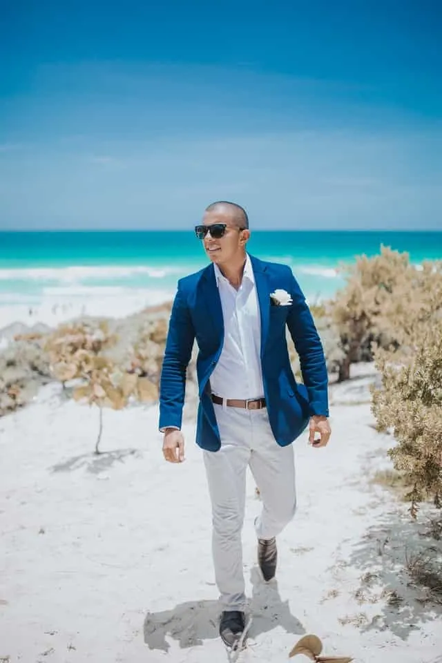 navy blazer with chinos on beach 