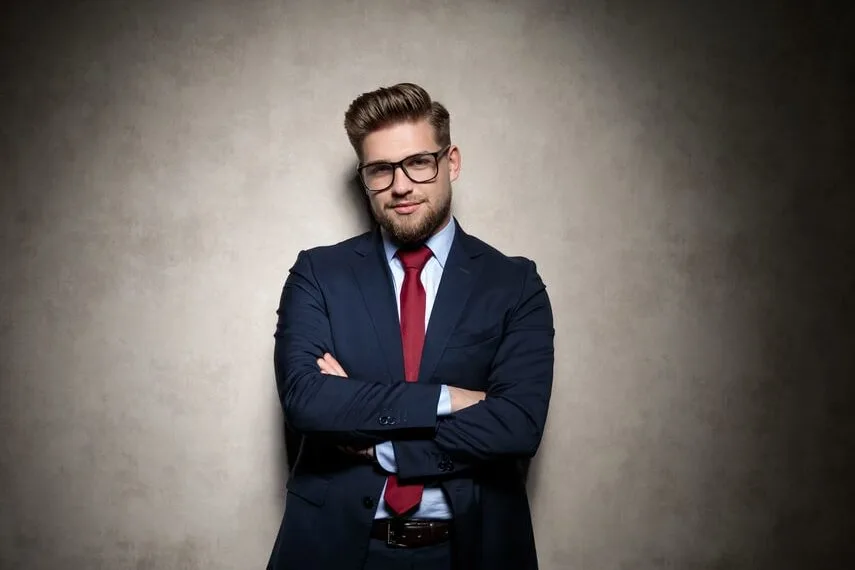 navy suit with blue shirt and red tie 