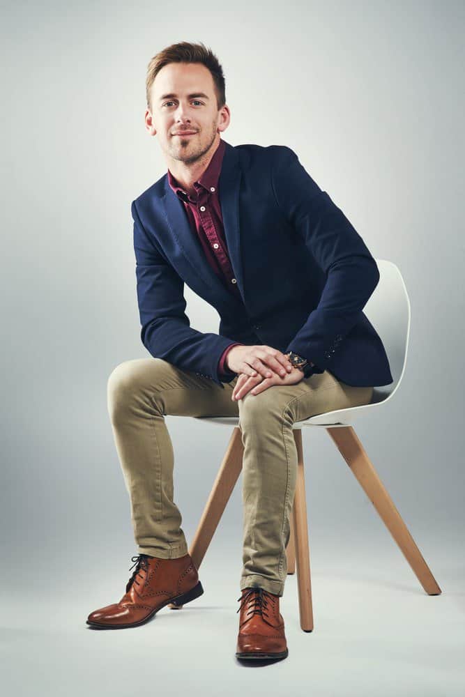 red shirt grey pants and brown shoes