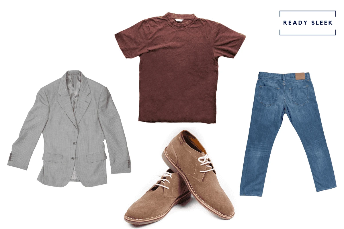 Casual grey blazer with maroon tshirt, medium blue jeans and suede chukka boots