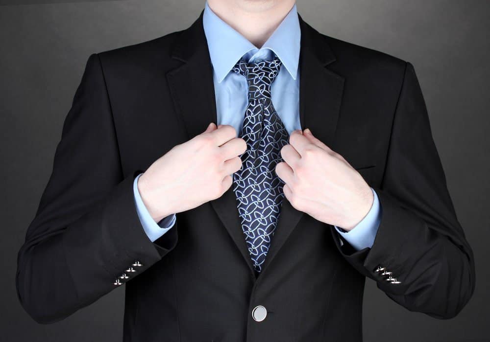 black suit blue shirt and tie