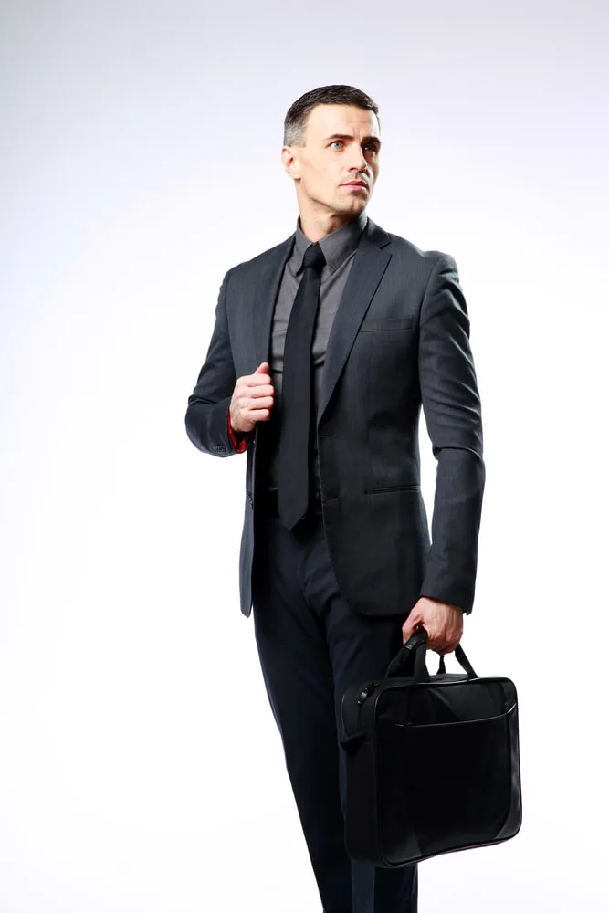 black suit grey shirt black tie