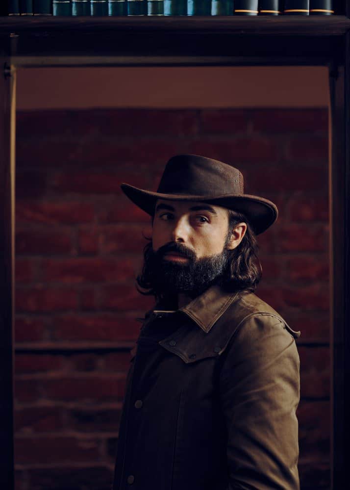 cowboy hat and long hair