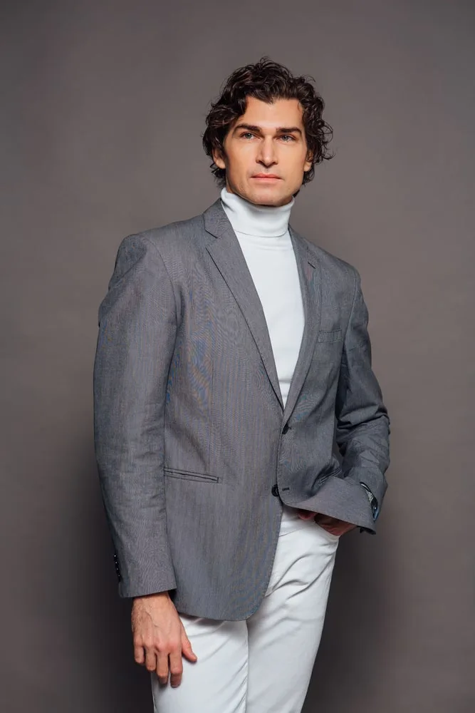 grey blazer with white turtleneck