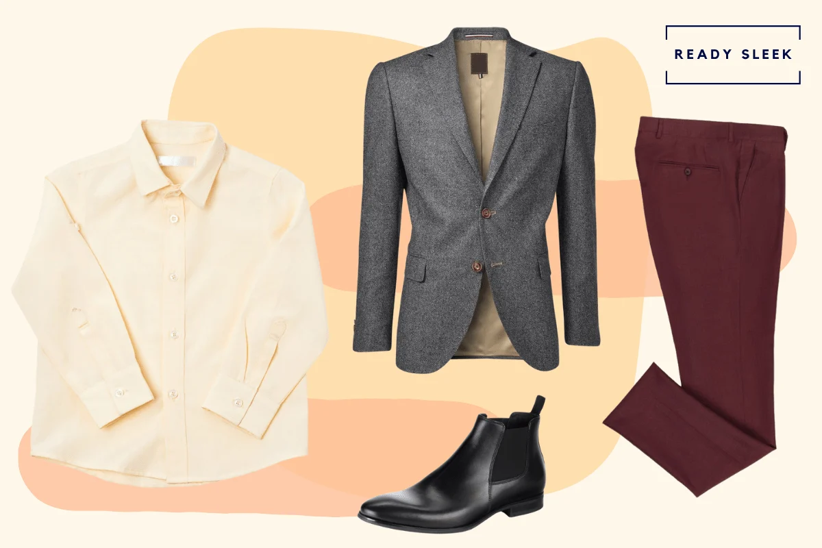 Black chelsea boots with maroon pants, tan shirt and dark grey blazer