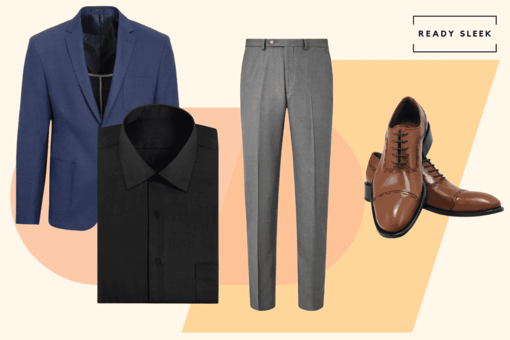 A man wearing a navy blue blazer with a black shirt, slate grey pants, and brown cap toe oxfords