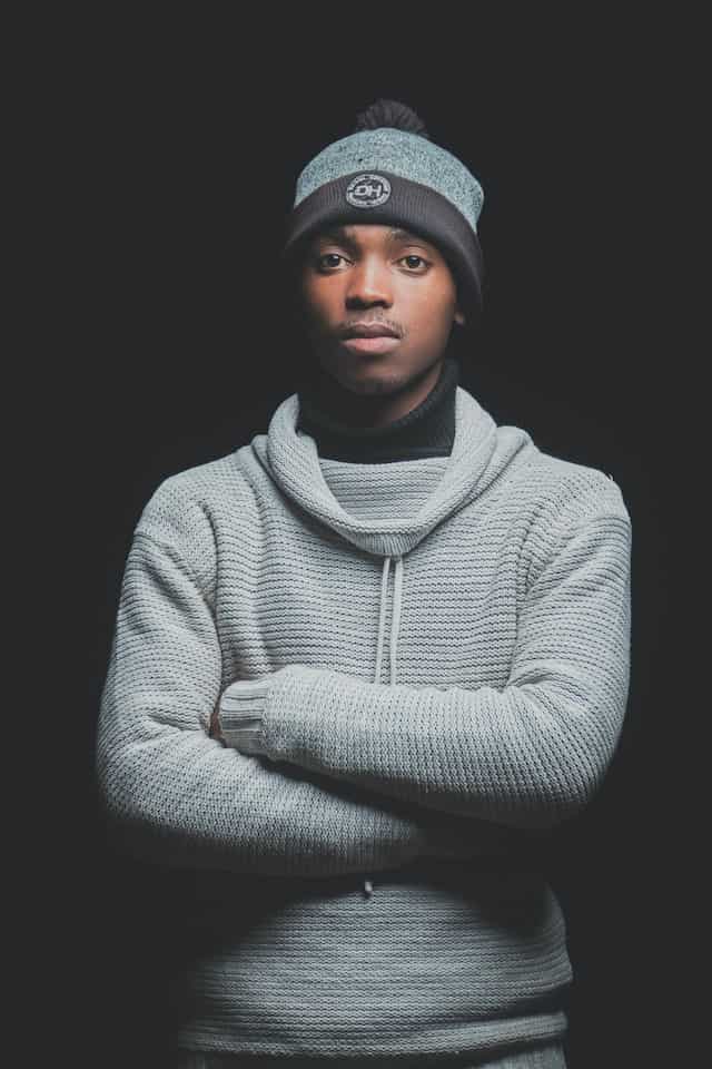 black turtleneck under grey sweater