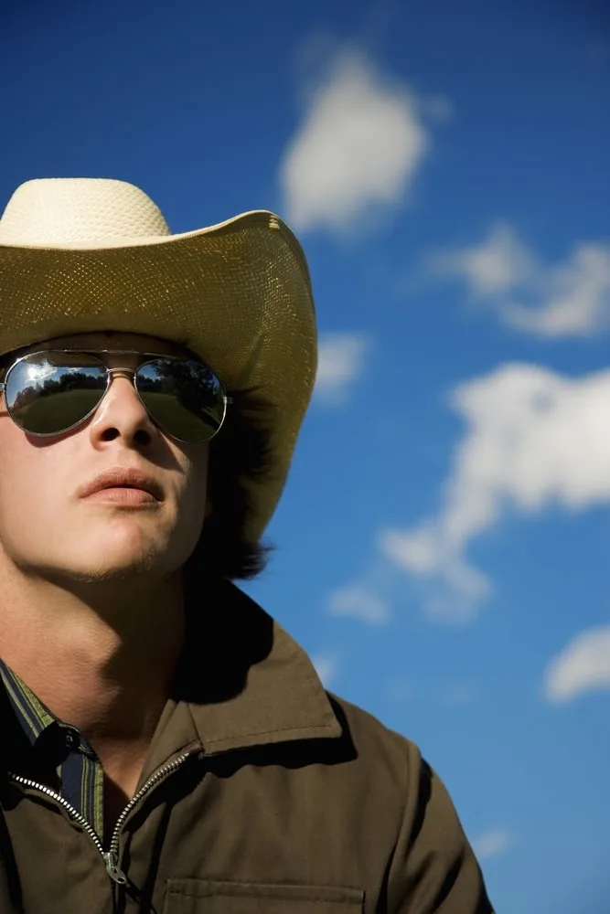 cowboy hat with aviator sunglasses 