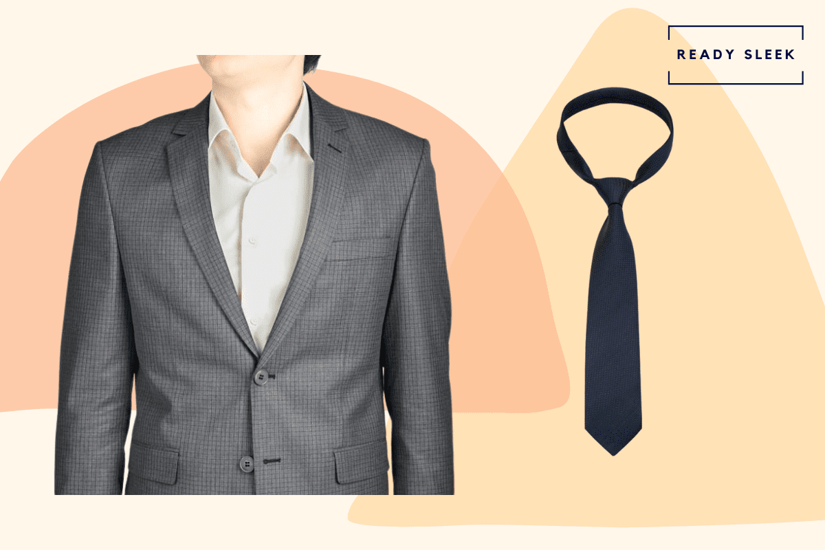 Medium grey suit with navy blue tie