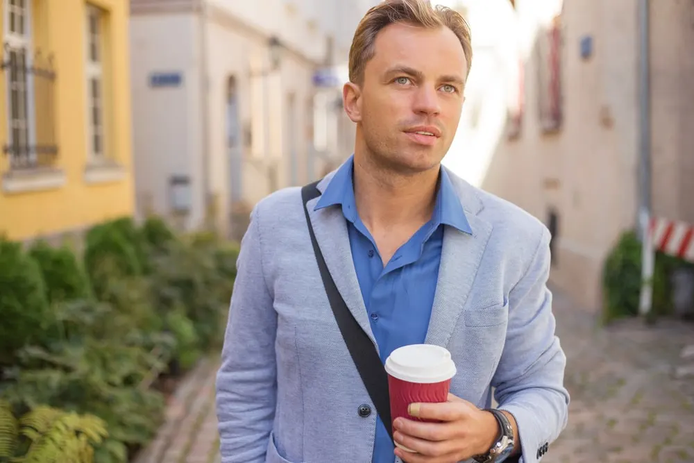 man in light blue blazer with dark blue shirt