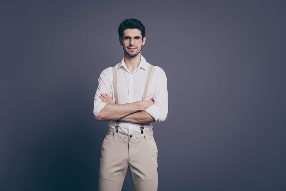 white shirt and khaki pants with suspenders 