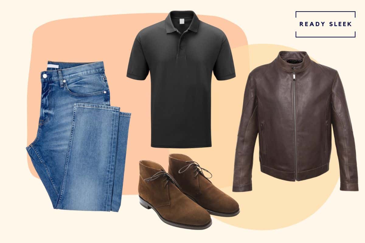 Light blue jeans with black polo shirt, brown leather jacket and brown chukka boots