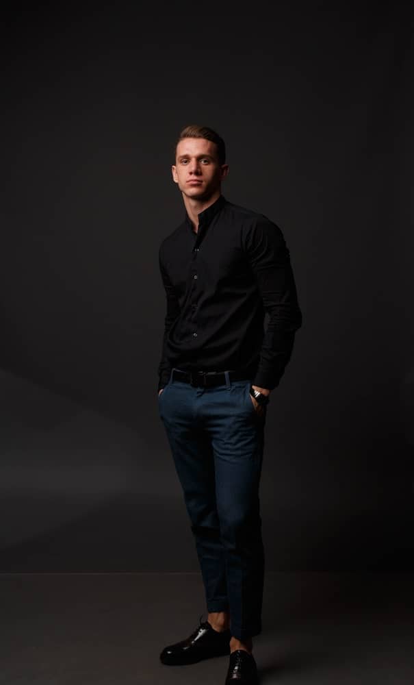 black shirt with navy pants and black shoes 