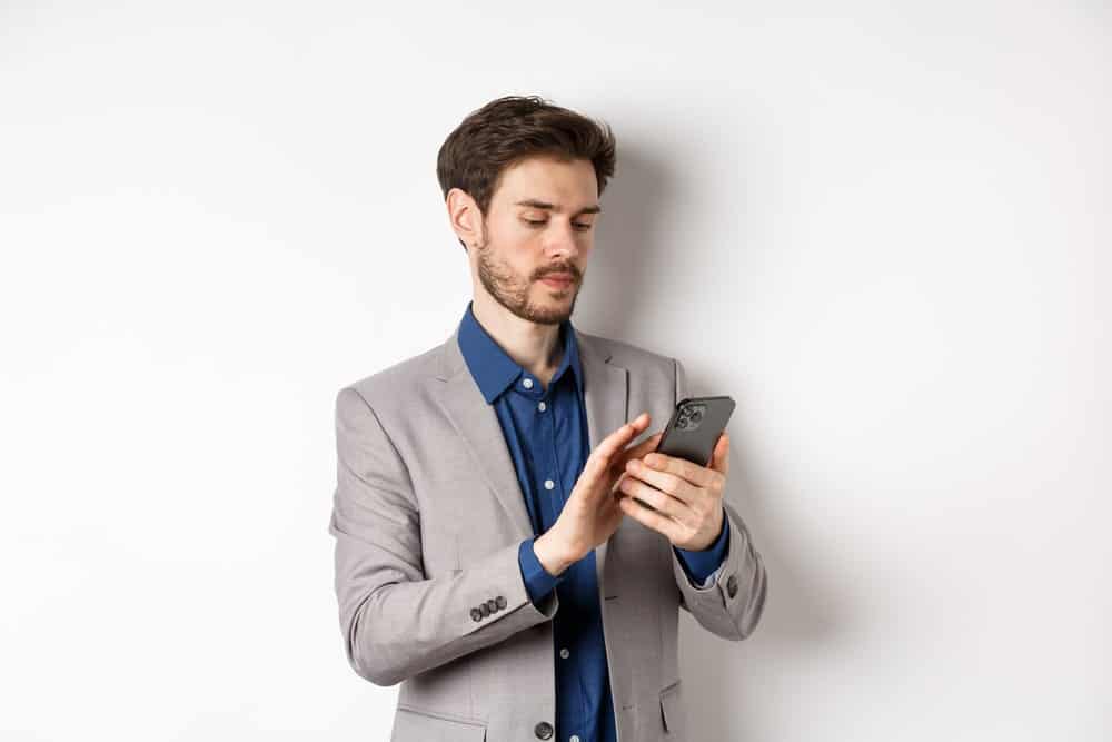 grey suit with dark blue shirt