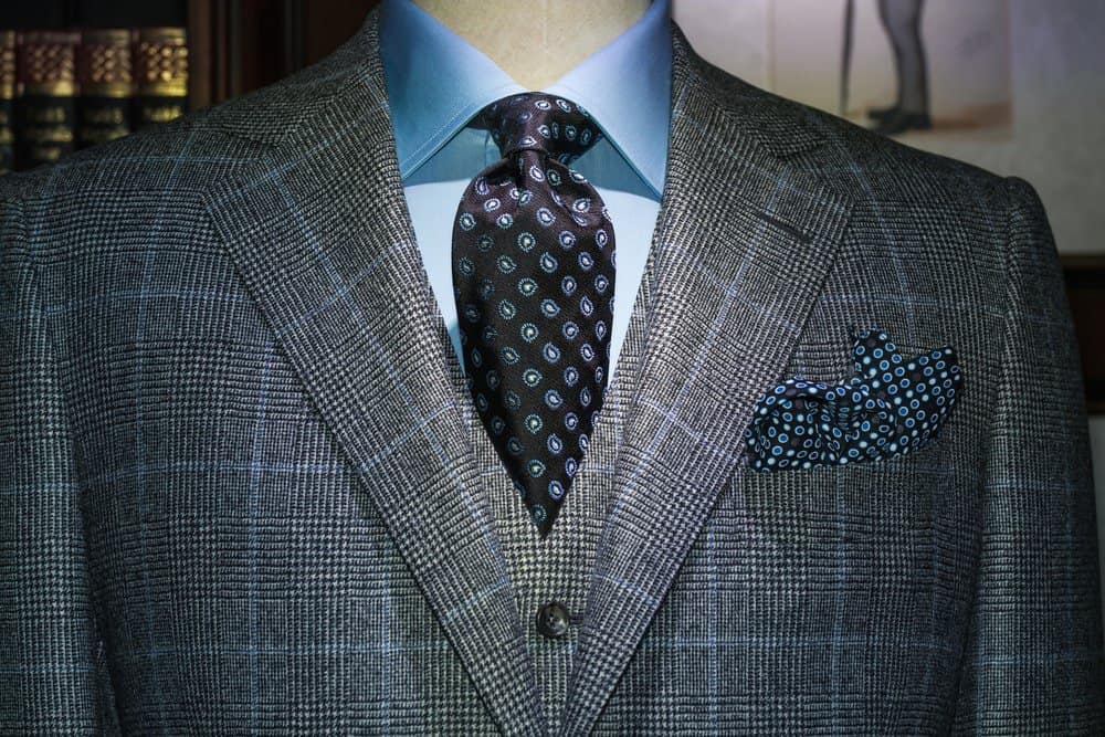 patterned grey suit with blue shirt