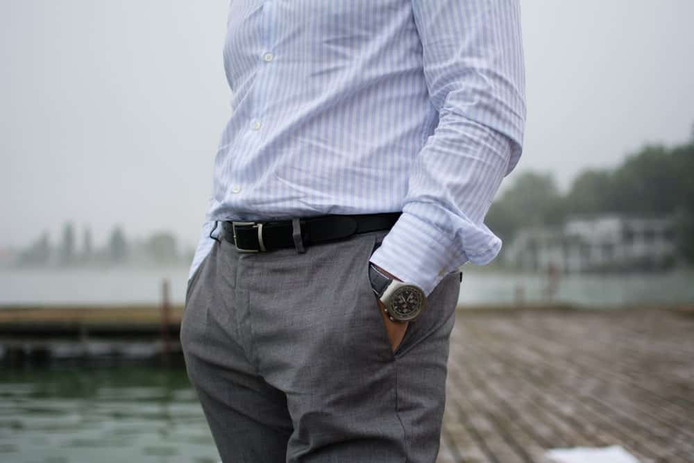 striped blue shirt and grey pants