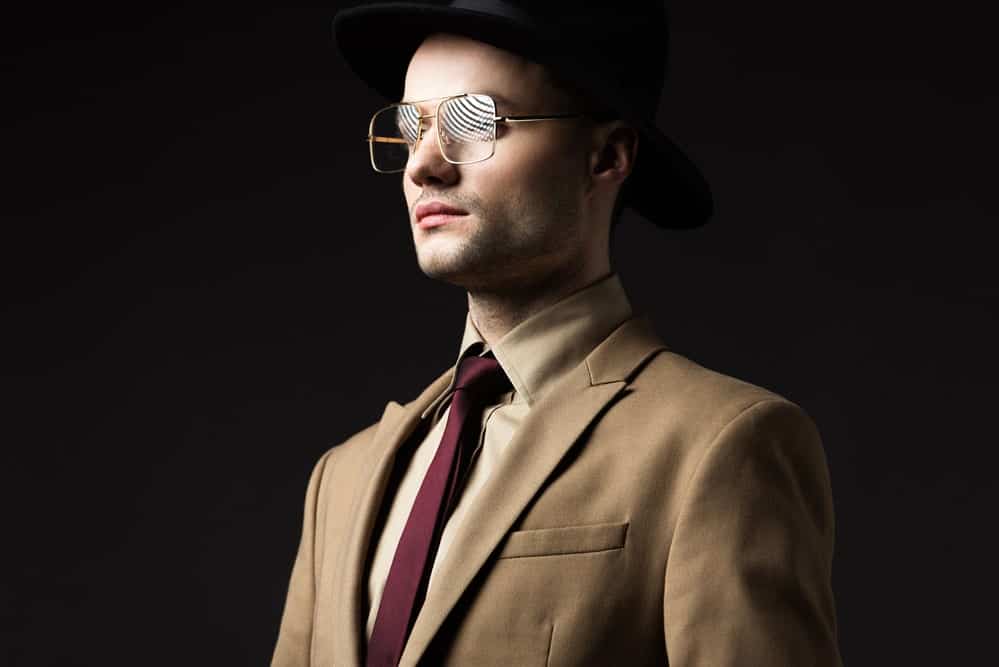 tan suit with burgundy tie