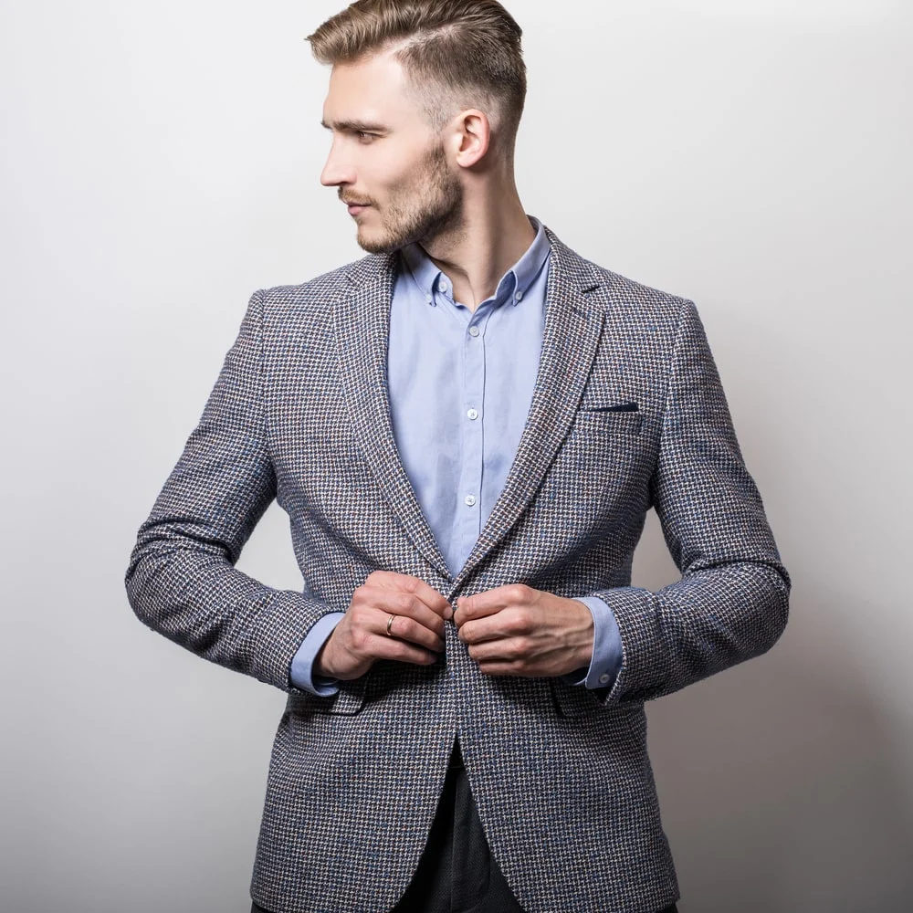 textured grey suit with blue shirt