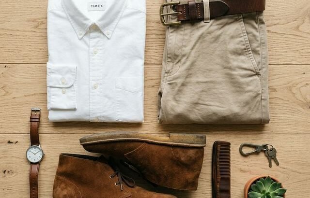 Chinos style guide flat lay with shirt, belt and desert boots