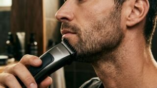 Man trimming 5 o'clock shadow stubble with precision trimmer